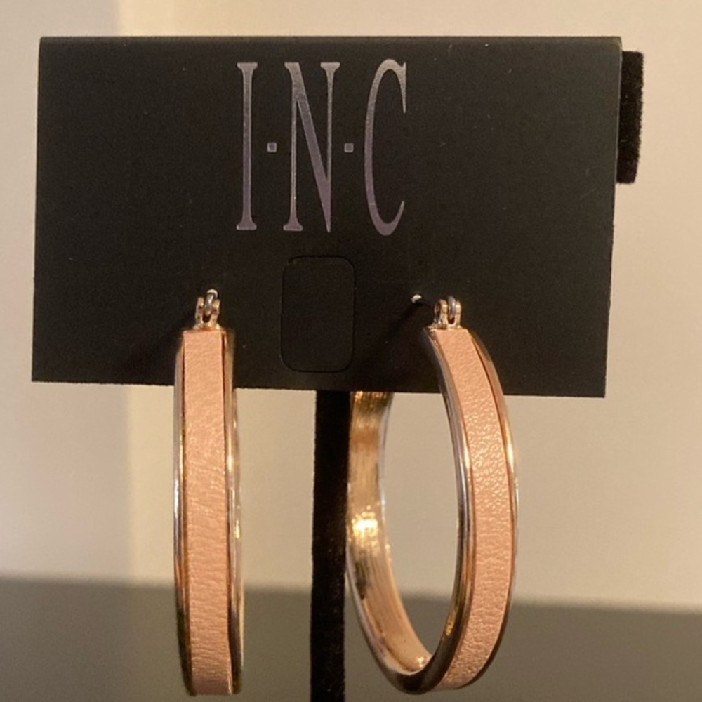Inc golden hoops with cream edge.